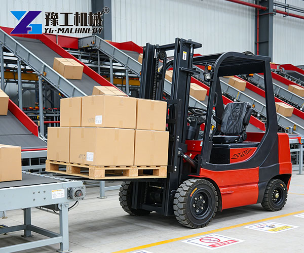 Forklift moving cartons in factory